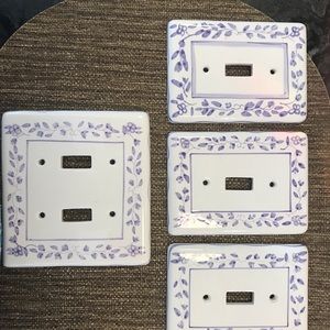 Ceramic decorative wall switch plates. 8 in total.